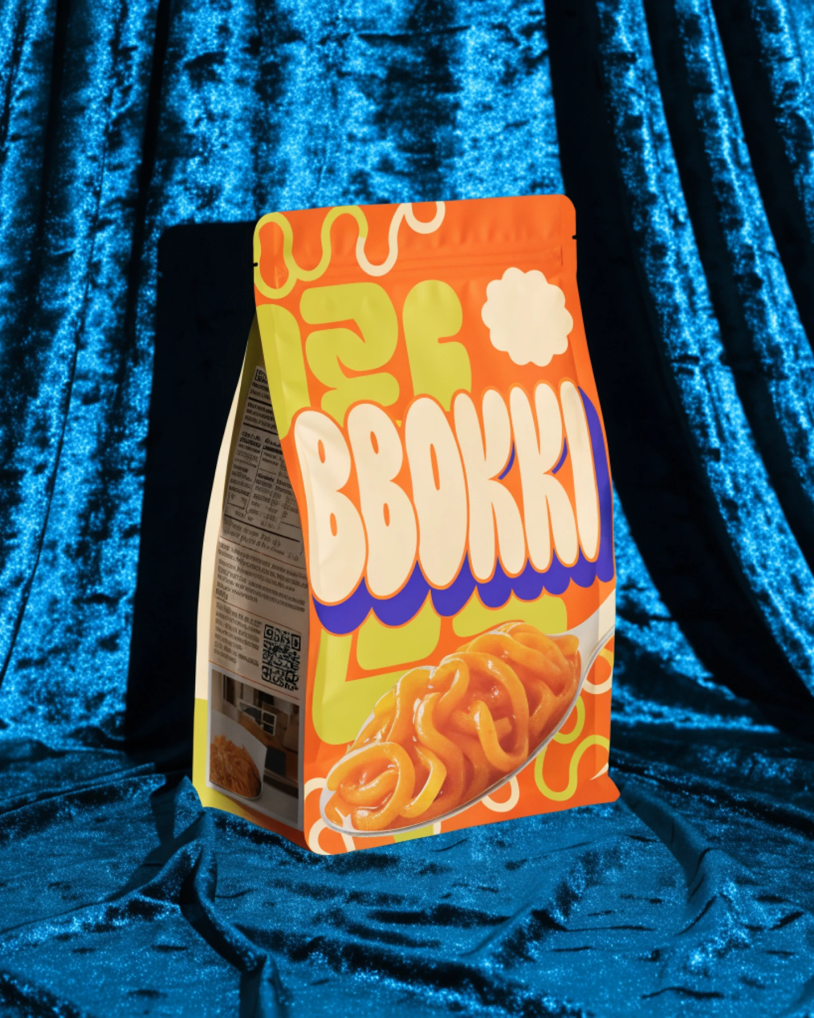 BBOKKI, a snack bag standing on crushed blue velvet
